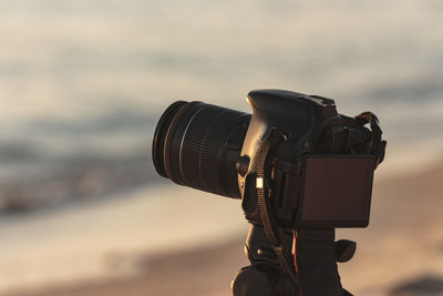 Close-up of camera on beach