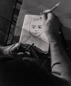 High angle view of man holding window