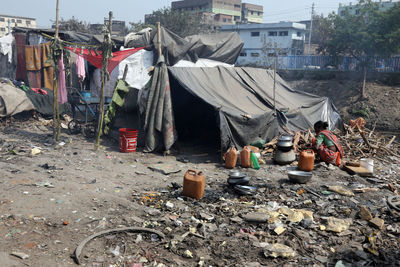 Garbage in building against sky in city