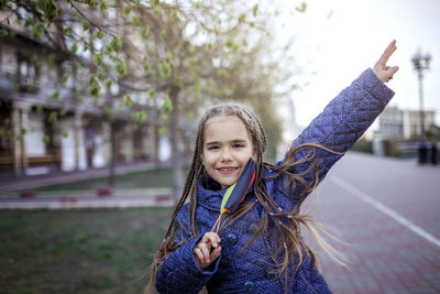 Portrait of girl standing on street