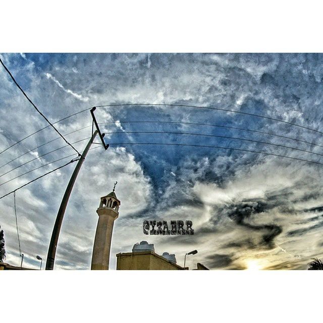 transfer print, auto post production filter, sky, cloud - sky, guidance, low angle view, built structure, cloudy, architecture, cloud, direction, communication, day, outdoors, no people, pole, building exterior, weather, text, western script