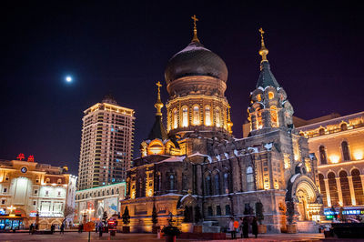 Low angle view of illuminated building at night