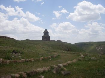Castle on field against sky