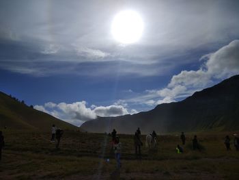 People on field against sky