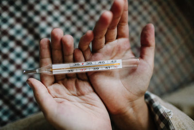 Close-up of person holding hands