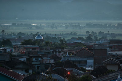 Aerial view of town against sky at night