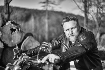 Portrait of man sitting outdoors