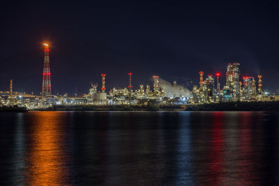 Illuminated city at waterfront