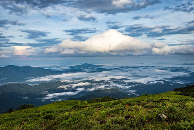 Mountain with green grass and beautiful sky