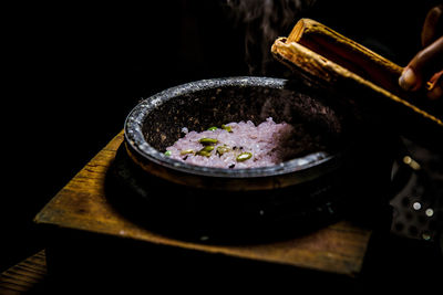 Cropped image of person preparing food