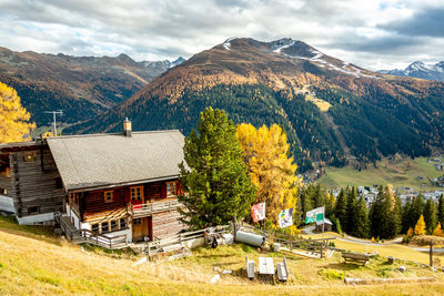 Houses and mountains against sky