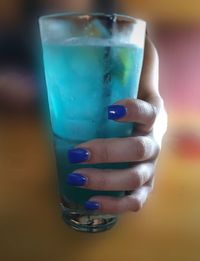 Close-up of hand holding ice cream