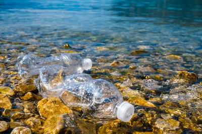 Plastic bottles abandoned on a beach. water pollution, microplastics, waste.