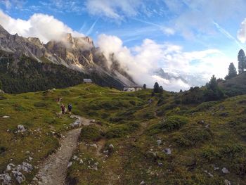 Scenic view of mountains against cloudy sky