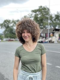 A young woman in a papakha - the national fur hat