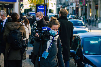 People walking on street in city