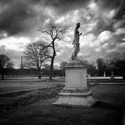 Statue of liberty against cloudy sky