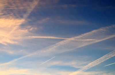 Low angle view of vapor trails in sky