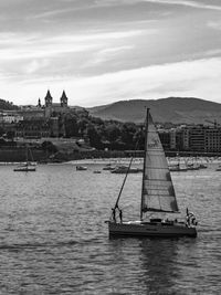 Sailboat in sea against sky