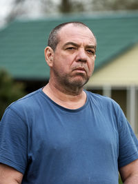 Portrait of man standing outdoors