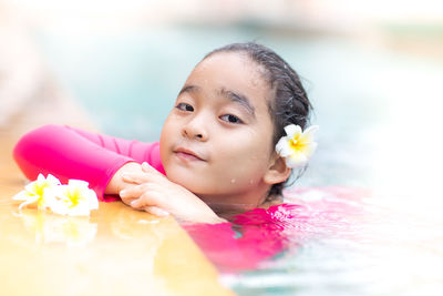 Portrait of baby girl in swimming pool