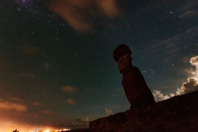 Silhouette man against sky at night