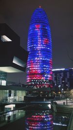 Illuminated buildings in city at night