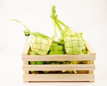 Close-up of fresh green box against white background