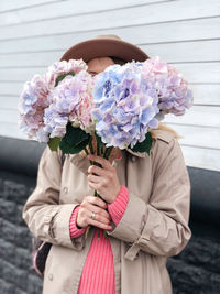 Woman holding flower bouquet