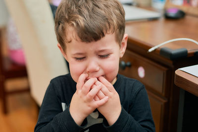 Young boy is upset and crying for some reason