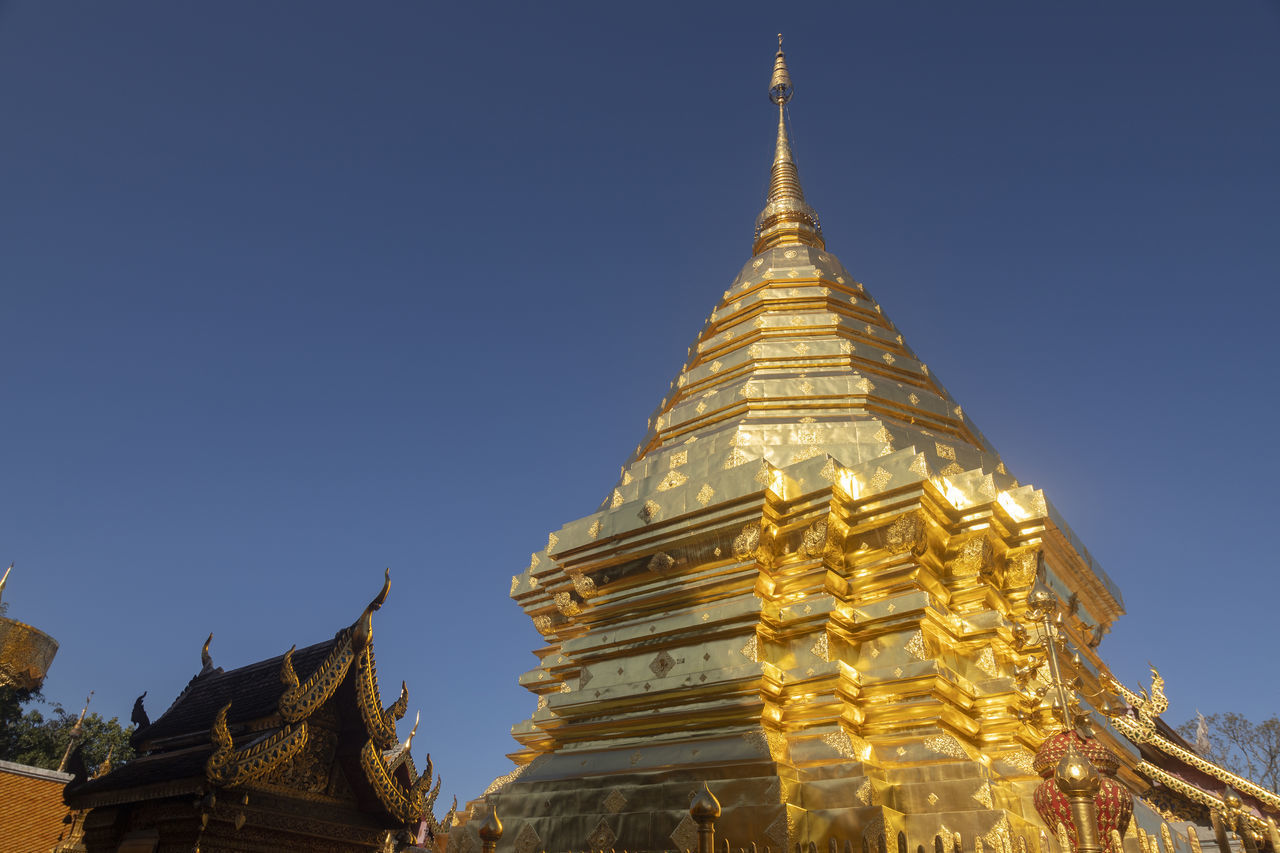 LOW ANGLE VIEW OF TEMPLE AGAINST BUILDINGS