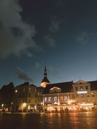 Illuminated buildings in city at night