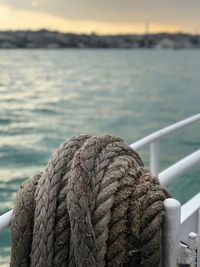 Close-up of rope tied to boat on sea