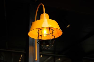 Low angle view of illuminated pendant light