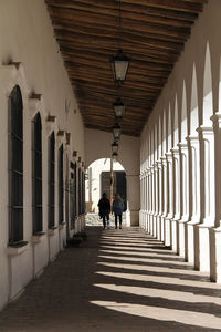 People walking in corridor