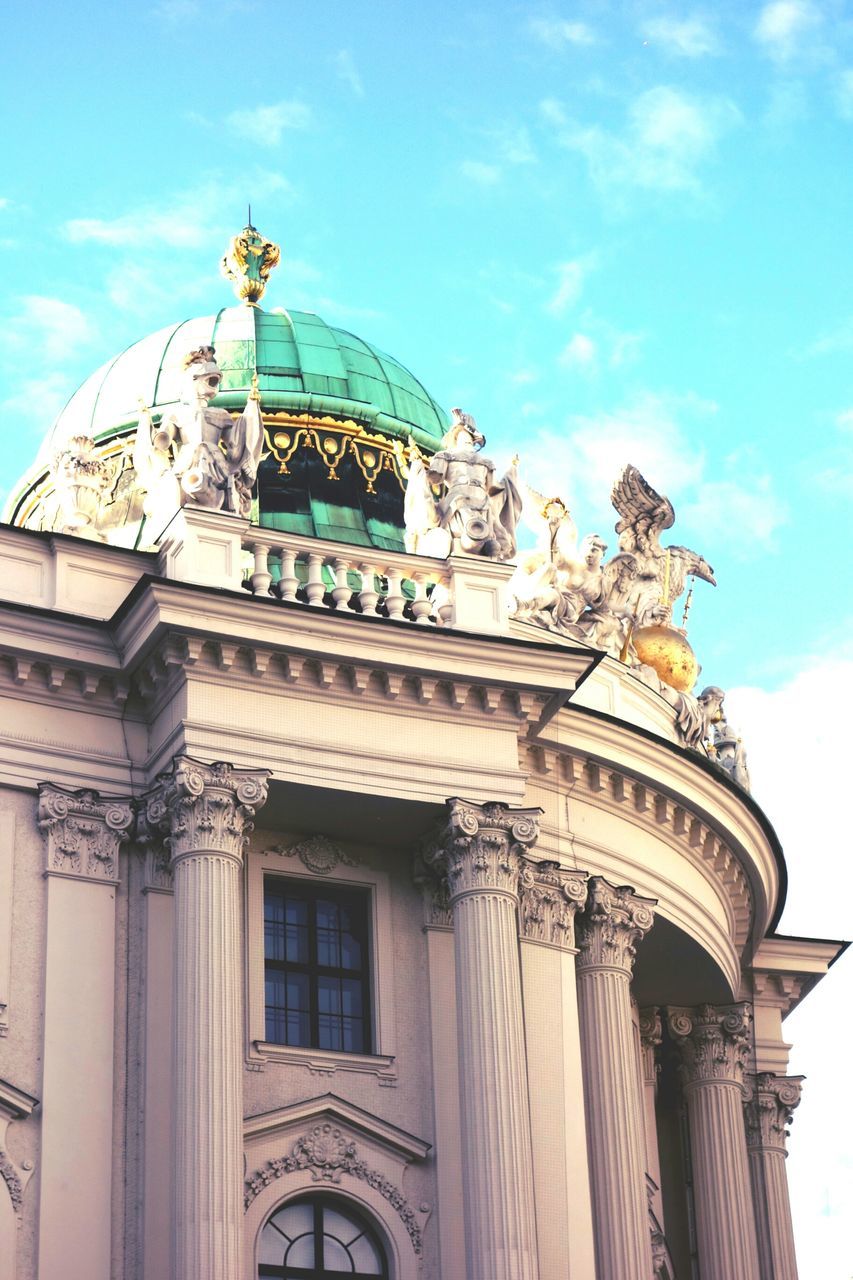 LOW ANGLE VIEW OF BUILT STRUCTURE AGAINST BLUE SKY