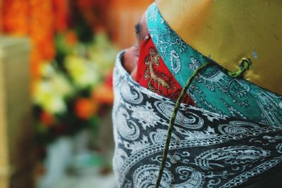 Close-up of person wearing scarf