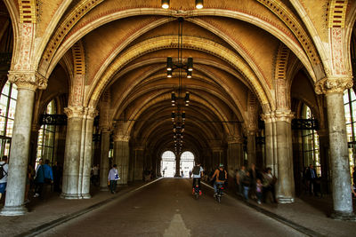 People in corridor of building