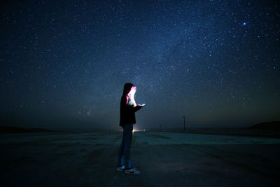 Full length of man standing on street against sky