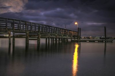 View of illuminated bridge against cloudy sky