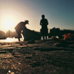 Surface level of people at sunset