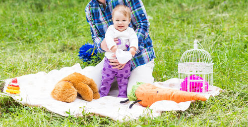 Portrait of cute boy with toy on field