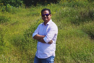 Man wearing sunglasses standing on land