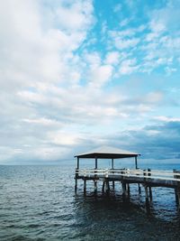 Pier over sea against sky