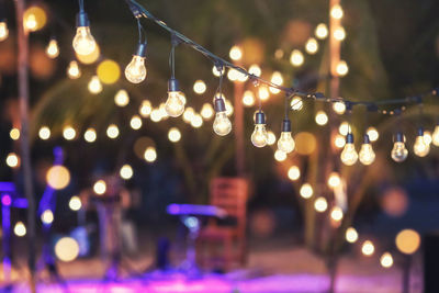 Hanging decorative lights for a wedding party