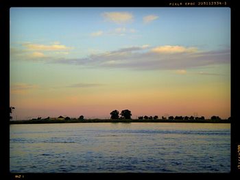 Scenic view of sea at sunset