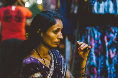 Young indian woman looking away at the market