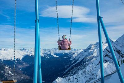 Mountain swing in winter at an altitude of 2200 meters