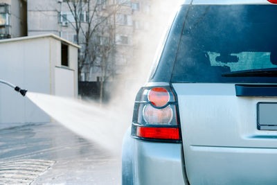 Car washing with pressure washer