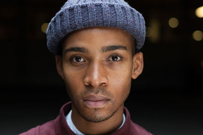 Close-up portrait of confident young man